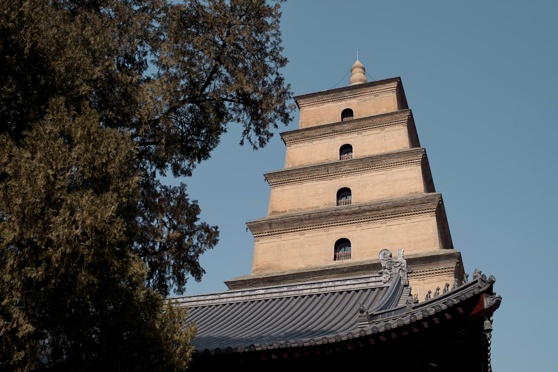 a tall tower with a clock on the top of it