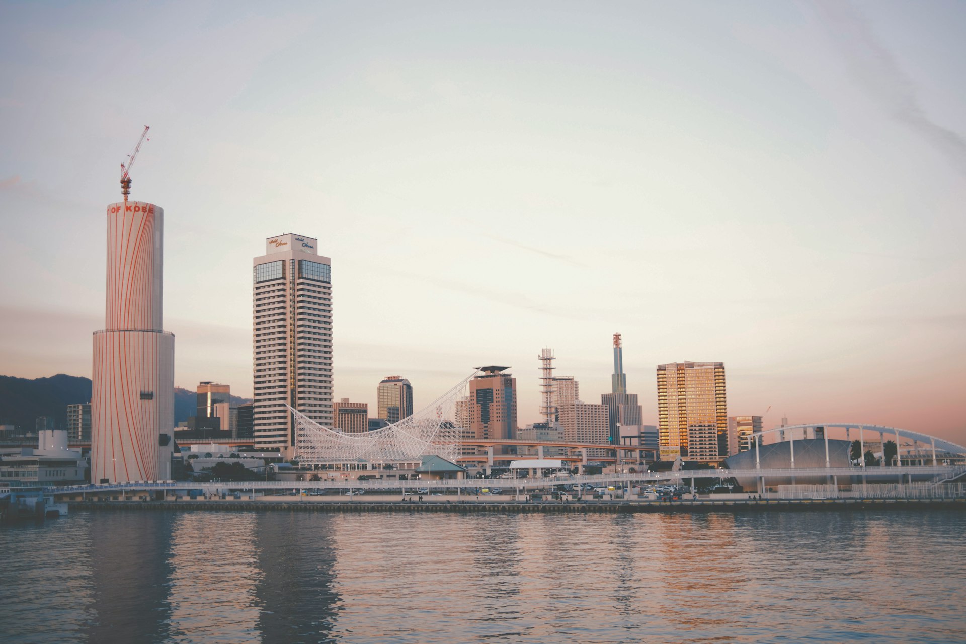 a large body of water with a city in the background