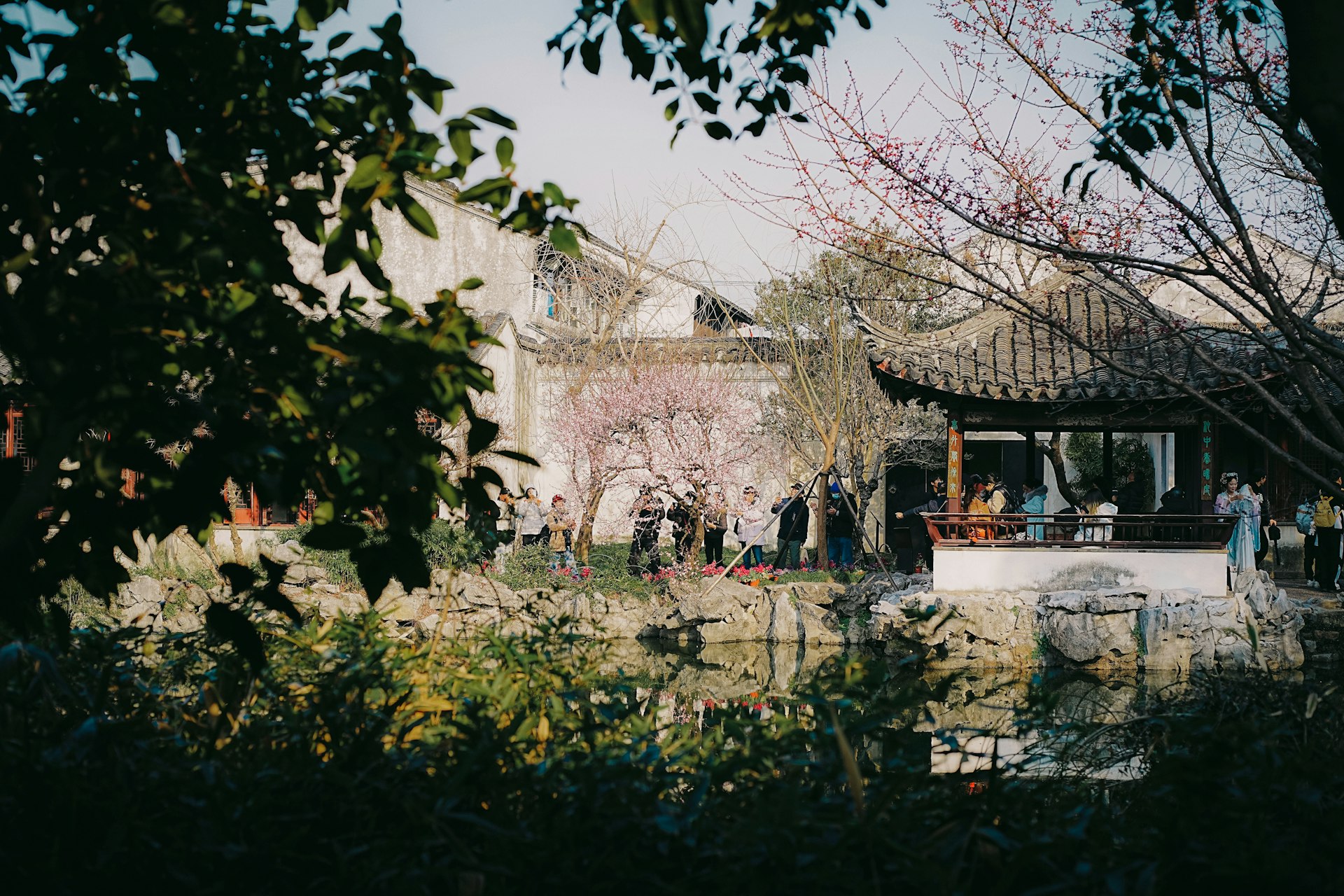 A group of people standing outside of a building