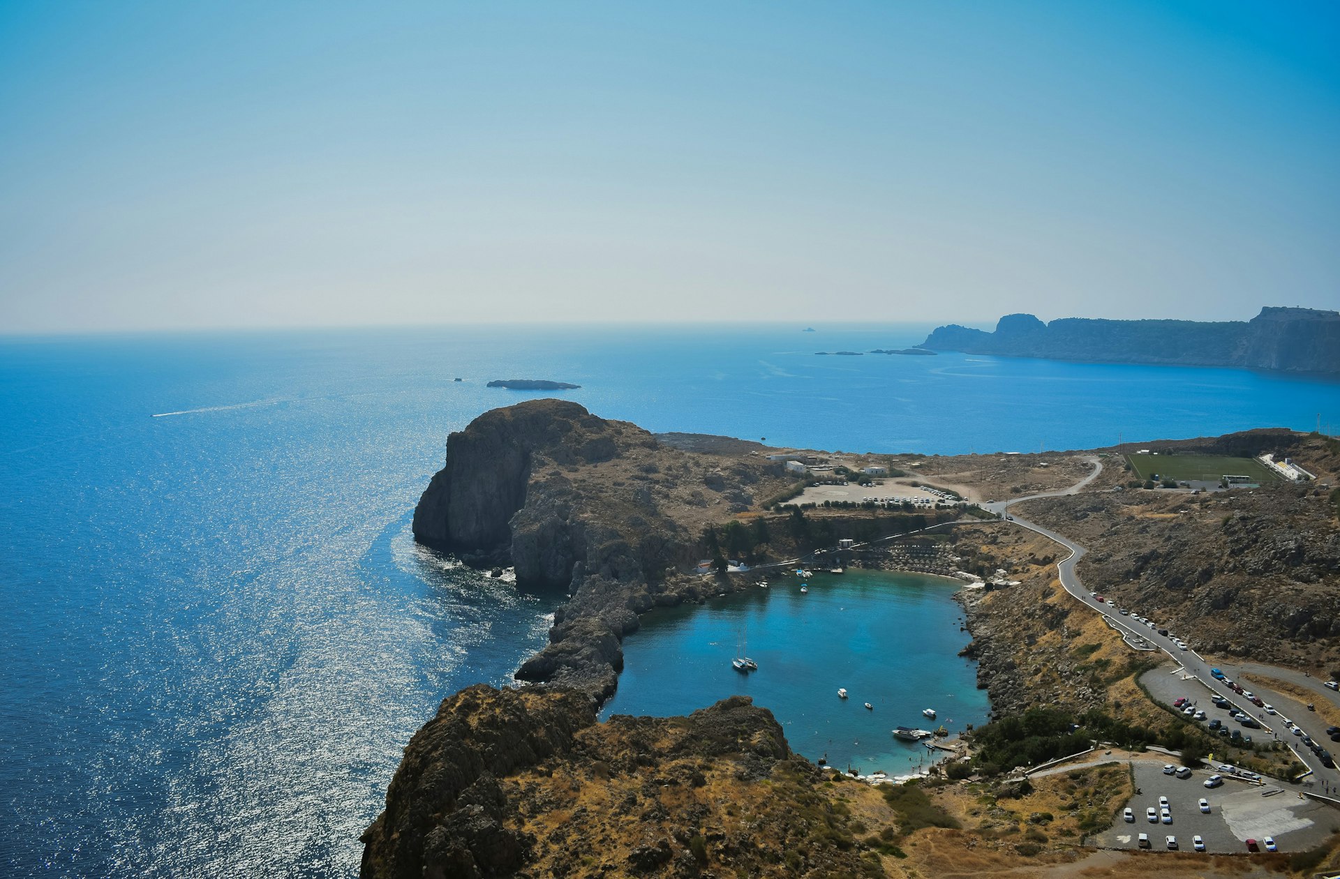 bird's eye view of a cliff and lake